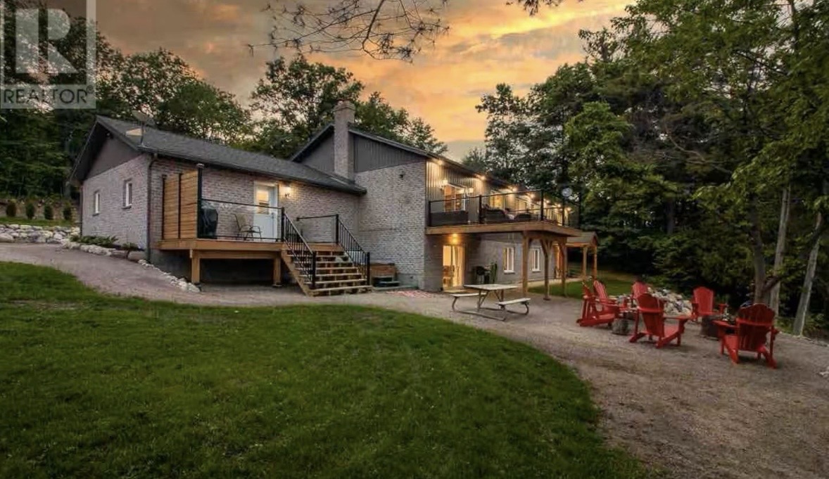 Custom northern Ontario home under construction at dusk